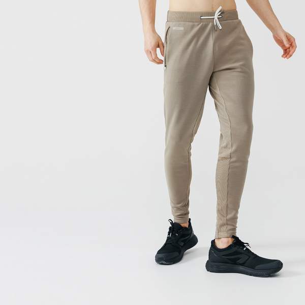 Брюки для бега утепленные зауженного кроя мужские бежевые RUN WARM+ Kalenji
